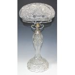 A cut glass table lamp, 20th Century, the dome top shade above a baluster stem and domed base,