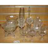 A group of assorted glassware, including a cut glass footed vase, an engraved decanter and stopper