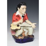 A Kevin Francis pottery prototype Toby jug of Elvis, modelled in Hawaiian shirt on a blue glazed