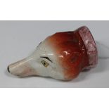 A small English fox head stirrup cup, circa 1840, naturalistically modelled and coloured with pink