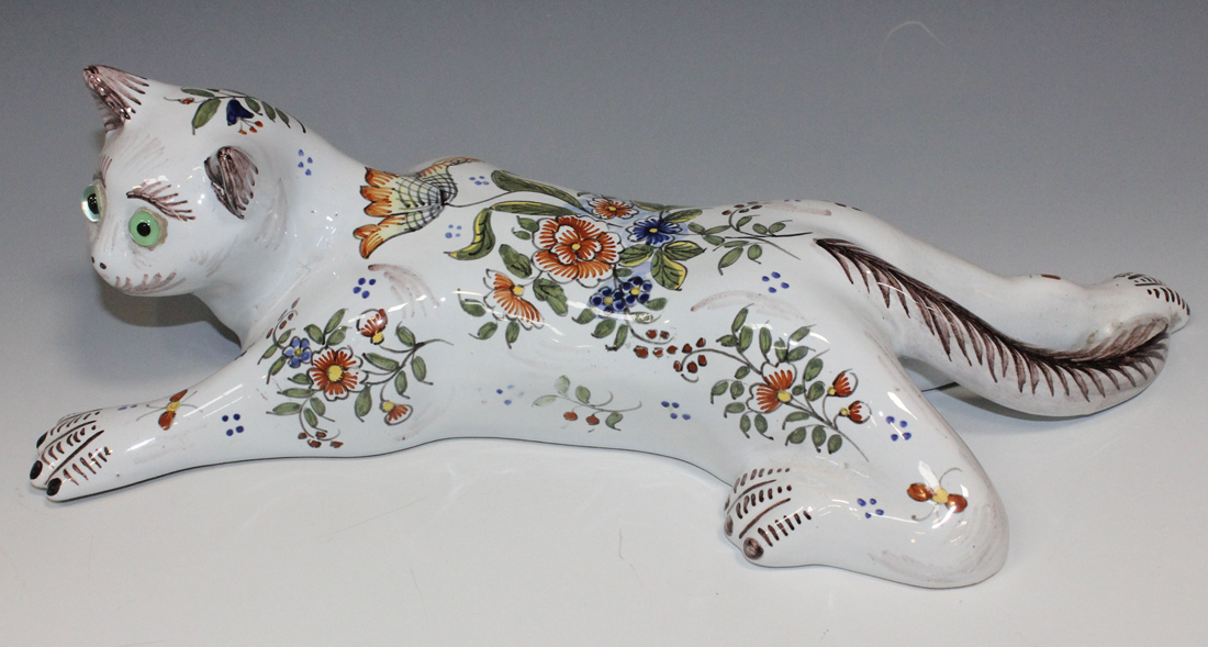 A Rouen faience wall pocket in the form of a cat, mid-20th Century, painted with flowers and inset