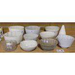 A collection of various jelly moulds, mostly white glazed, including examples by Copeland and