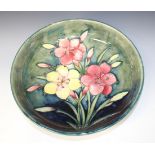 A Moorcroft pottery Freesia pattern circular bowl, 1928-49, the base interior decorated with a spray