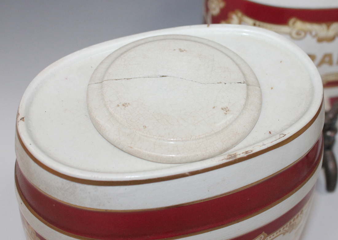 A set of four Staffordshire pottery spirit barrels with magenta and gilt banding, detailed in - Image 4 of 4