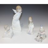 Four Lladro porcelain figures, comprising Curious Angel, No. 4960, Angel Thinking, No. 4539, Mary,