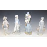 Four Lladro porcelain figures, comprising Going Fishing, No. 4809, Boy with Yacht, No. 4810, Balloon
