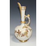 A Royal Worcester porcelain Persian ewer, circa 1886, decorated with gilt blossom against an ivory