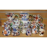 A mixed group of eight Mason's Patent Ironstone China octagonal serpent handle jugs, mostly circa