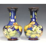 A pair of Doulton Lambeth faience vases, late 19th Century, decorated by Alberta L. Green and