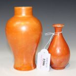 Two Royal Doulton orange lustre glazed vases, the first of pear shape, the second of high shouldered