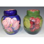 Two Moorcroft Pottery ginger jars and covers, circa 1949-86, the first decorated with pink