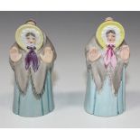 Two Royal Worcester porcelain Granny Snow candle snuffers, circa 1925 and 1930, each wearing a