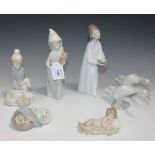 A group of four Lladro porcelain figures, comprising Baby Jesus, No. 4670, Shepherd with Lamb, No.