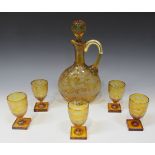 A Bohemian amber flash glass decanter set, late 19th Century, comprising decanter and stopper and