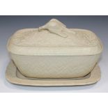 A caneware beige coloured pie dish, cover and stand, mid-19th Century, of rectangular shape, the