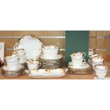 A Royal Doulton 'Honesty' pattern part tea set, comprising twelve cups and saucers, twelve side
