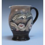 A Moorcroft Pottery matt glazed Fish pattern jug, circa 1930, the swollen body with horizontally