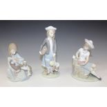 Three Lladro porcelain figures, comprising Autumn, No. 5218, Sleepy Kitten, No. 5712, and Sunday's