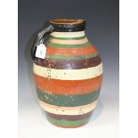 An Ian Godfrey studio pottery large jug, 1970s, of ovoid shape with loop handle, glazed with