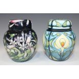 Two small Moorcroft Pottery ginger jars and covers, both designed by Emma Bossons, the first