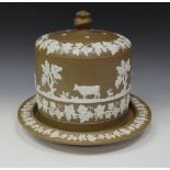 A stoneware cheese dome and stand, second half 19th Century, the brown body sprigged in white with