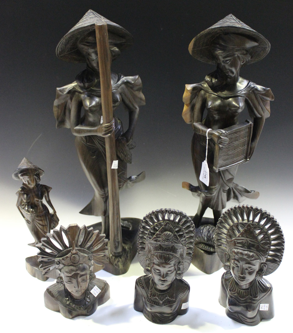 A group of mid/late 20th Century Balinese carved hardwood figures, including a pair of figures of
