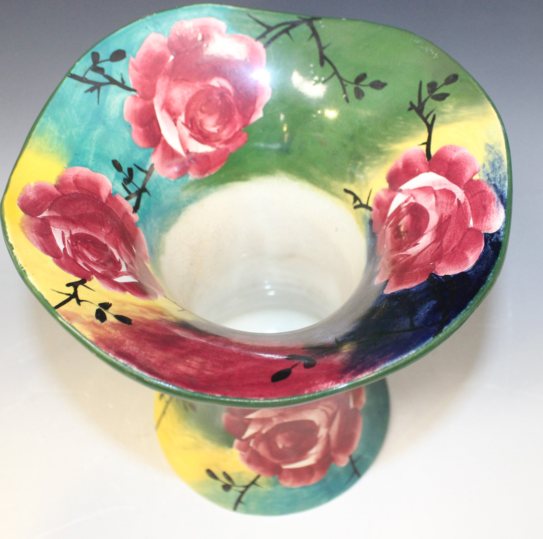A Wemyss pottery jazzy ware trumpet vase, painted with cabbage rose on a colourful ground, - Image 4 of 4