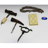 A group of collectors' items, including a visiting card case, three corkscrews, an enamelled