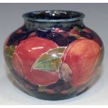 A Moorcroft pottery vase, circa 1916, of squat circular form decorated with the Pomegranate design