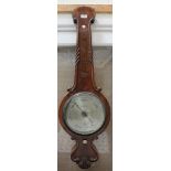 A Victorian burr walnut cased wheel barometer with mercury thermometer and silvered dials