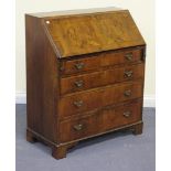 An Edwardian walnut and crossbanded bureau, fitted with a fall flap above four long graduated