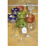 A set of six hock glasses, 20th Century, each with cut green, blue or cranberry bowl, on a faceted