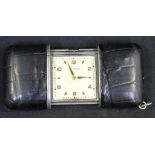 A Movado base metal and leather mounted rectangular cased purse watch, the signed square silvered
