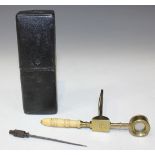 An early 19th Century lacquered brass folding pocket microscope with turned bone handle and specimen