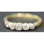 A gold and diamond five stone ring, collet set with a row of cushion shaped diamonds graduating in