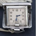 A silver square cased folding travelling watch, the square silvered dial with Arabic numerals,