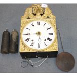 A 19th Century French brass wall alarm clock with eight day movement striking on a bell, the white