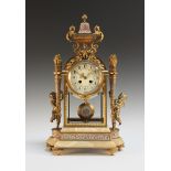 A late 19th Century French ormolu, champlevé enamel and pale brown onyx four glass mantel clock with
