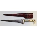 An Indian pesh-kabz with straight T-section blade, length approx 19.5cm, white metal hilt with