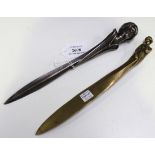 An Art Nouveau silvered cast bronze paperknife, the handle cast in the form of a maiden's head,