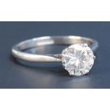 A platinum and diamond single stone ring, claw set with a circular cut diamond, approx 1.5cts,