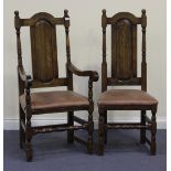 A set of eight modern oak dining chairs, comprising two carvers and six standard, with upholstered