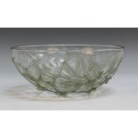 A Lalique clear, green tinted and frosted glass Gui pattern circular bowl, number 3223, the