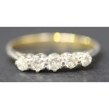 A gold and diamond five stone ring, claw set with a row of graduated circular cut diamonds, detailed