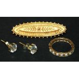 A late Victorian 15ct gold oval brooch, decorated in the classical taste, with a beaded border,