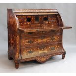 An early 19th Century Dutch floral marquetry roll-top cylinder bureau, decorated with all-over