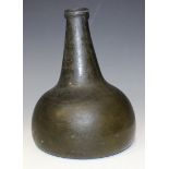 An olive green tinted onion shaped glass wine bottle, 18th Century, with kick-in base and string