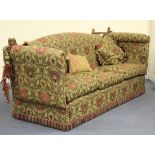 A modern three seat Knole style settee with drop ends, upholstered in patterned fabric, height