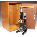 A black enamelled monocular microscope, signed 'C. Baker 36885 London, R.V.C, No. 209', with rack
