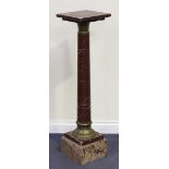 A late 19th Century rouge marble and gilt metal mounted pedestal, the square top above an embossed